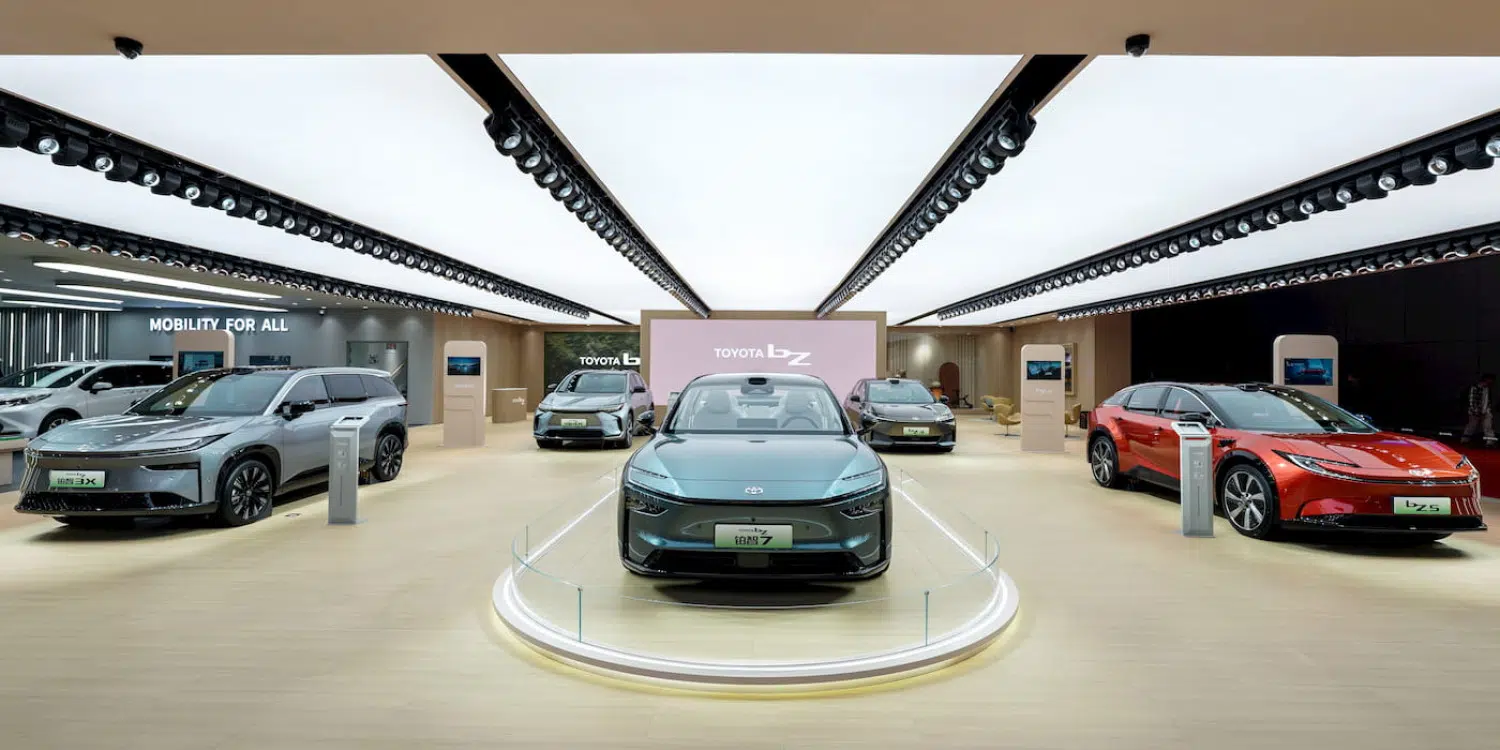 A bunch of cars are on display in a showroom