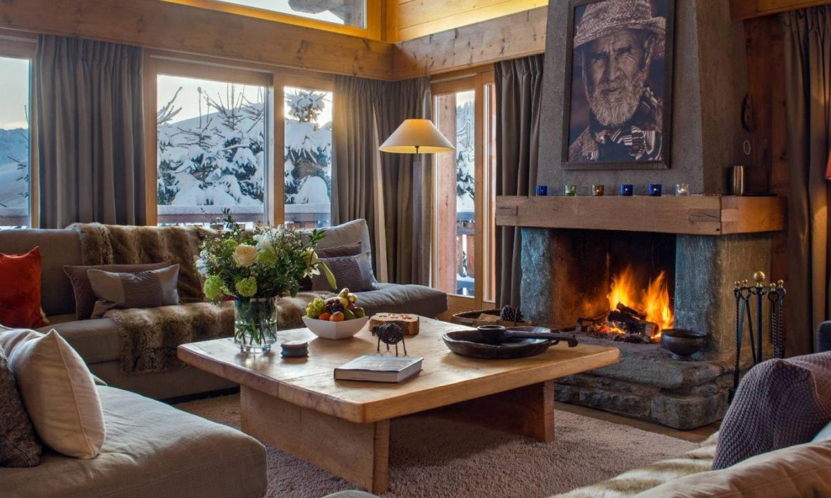 A living room filled with furniture and a fire place